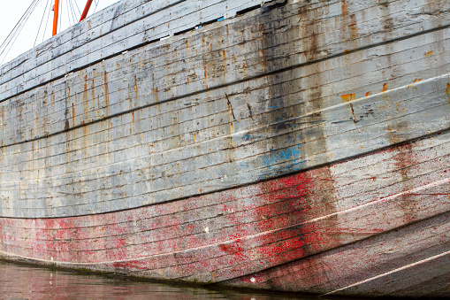 Patched stern of an old wooden fishing boat
