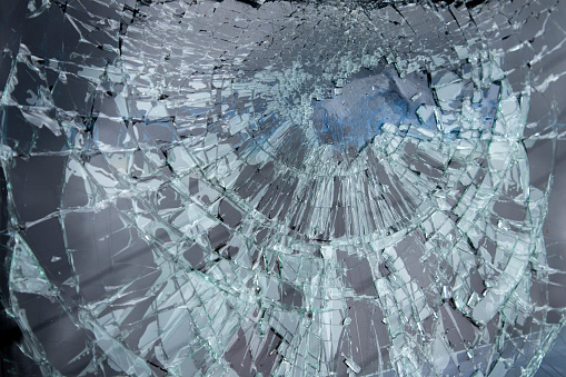 Crack, Broken Glass In A Double-glazed Window Due To Manufacturing Defect Or Temperature Difference In Building, Home. Manufacturer's Defect, Defective Products. Horizontal Plane. Closeup