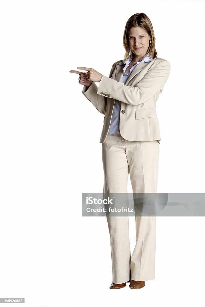 standing woman shows a young business woman with white suit point Adult Stock Photo