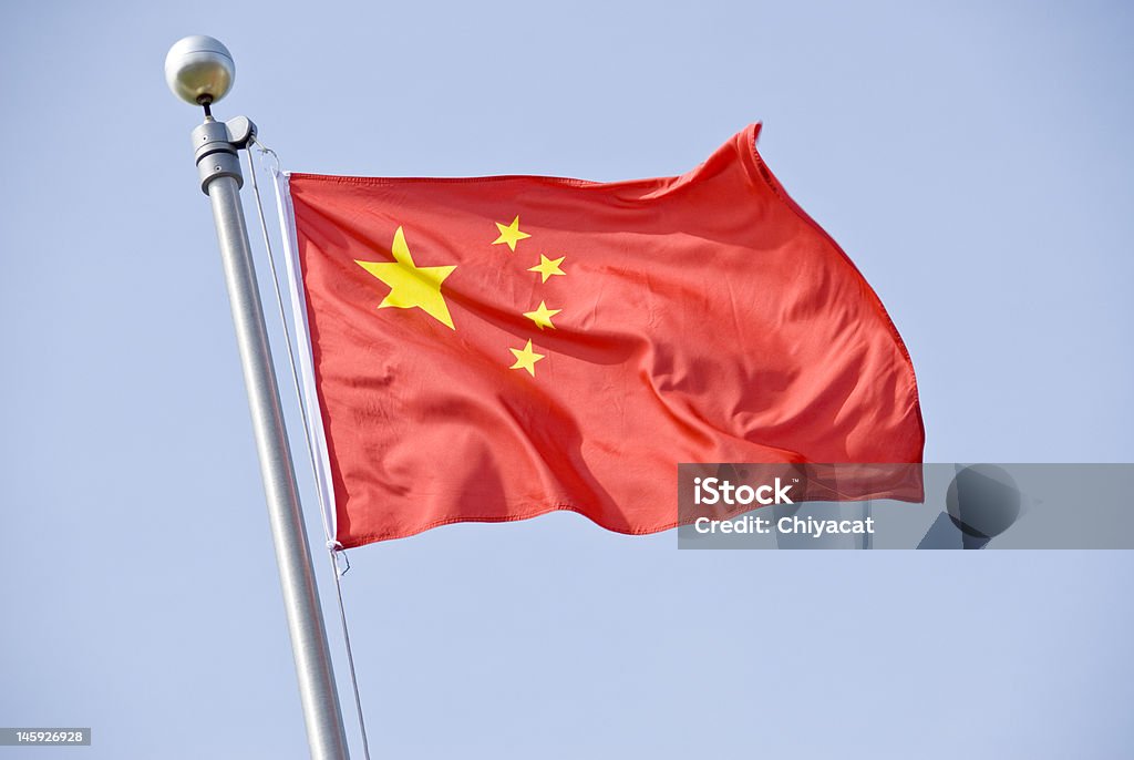 Chinese Flag Five star red Chinese flag flying against the blue sky. Chinese Flag Stock Photo
