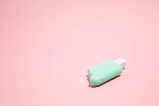 istock Ice cream toy made from plastic on pink background with copy space 1459271397