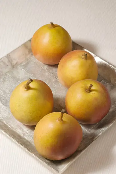 small pears on square plate