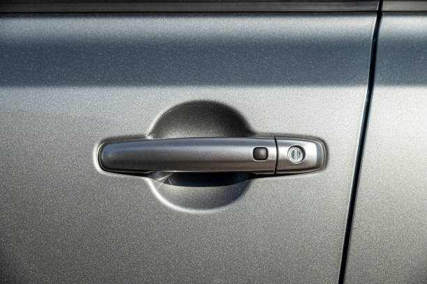 istock Car door handle with unlock button. keyless entry car door handle with touch sensor 1459272396