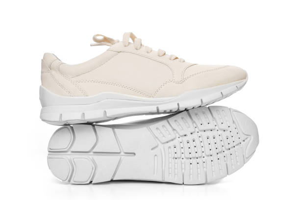 istock leather sneakers with lacing and perforated sole on a white background. 1459272990