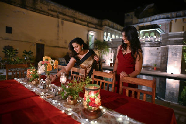 istock Two beautiful women decorating and arranging a dinner table for an outdoor dinner party 1459273579