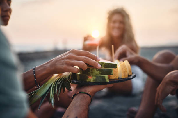 istock Eating fresh fruit on the beach at sunset! 1459275869