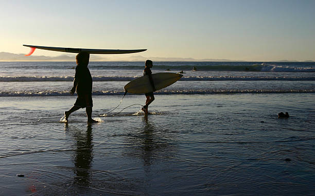 istock different ways of carrying a surfboard 145927861