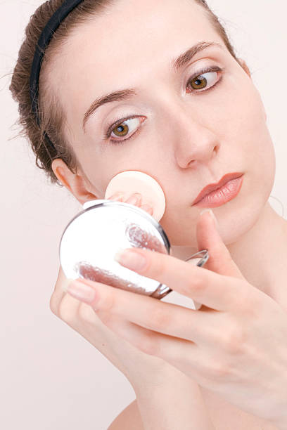 istock closeup of woman applying foundation 145928193