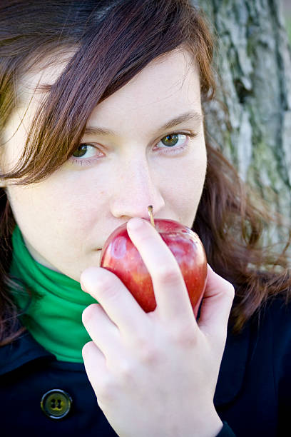 istock Young woman and red apple 145928384