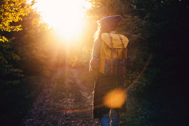 istock Unrecognizable young woman hiking during sunset 1459284406