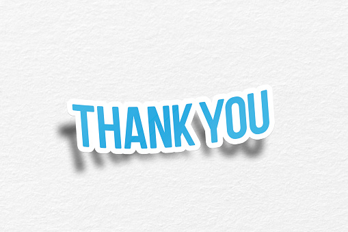 Thank you message on curled paper with white background