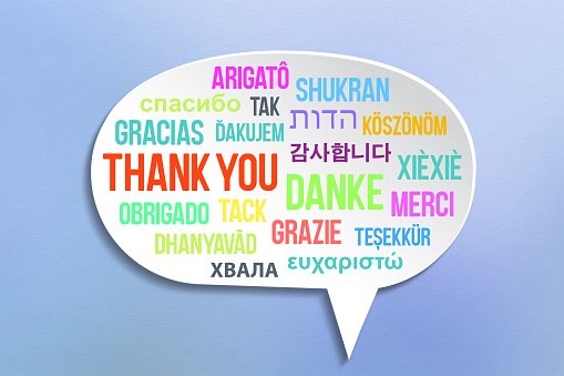 Thank you message in many different languages on speech bubble