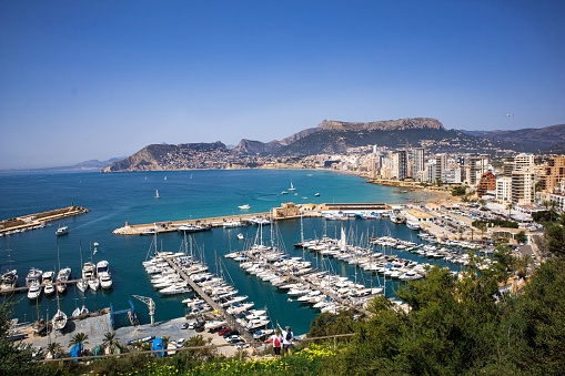 A beautiful view of the sea port and the promenade of the Prince of Asturias in Calpe, Spain