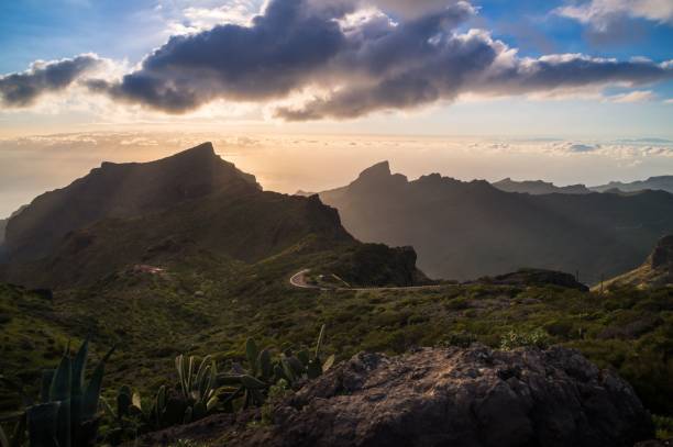 istock Aerial shot of a beautiful mountain range with a cloudscape and sunlight 1459286696