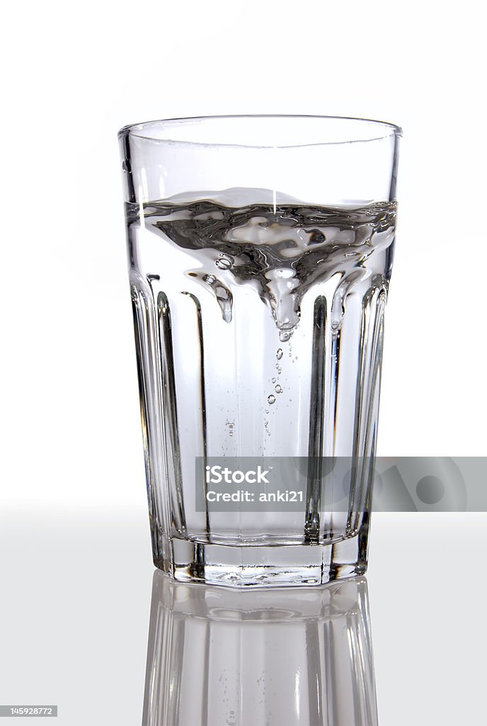 glass of water A glass of water on a reflective surface Cup Stock Photo