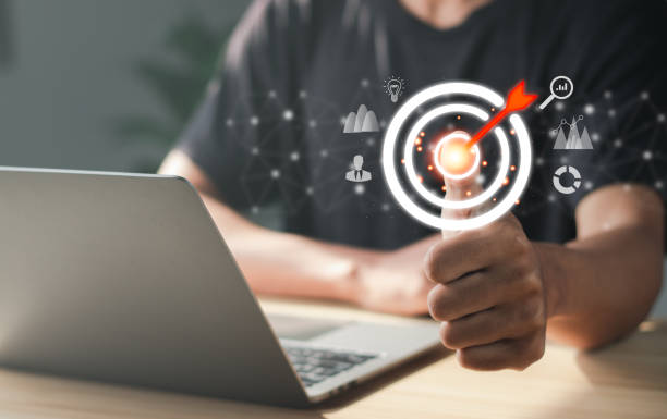 istock Businessman pointing to target icon on virtual interface. Startup business. Goal Setting Ideas, Objectives and Investment Goal Ideas. 1459288534
