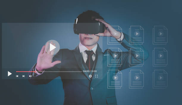 istock Business, technology, internet and networking concept. Asian businessman exploring virtual reality with VR headset press the play button on the virtual display. 1459288651
