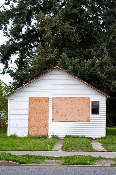 boarded-up house stock photo