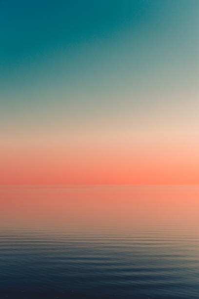 istock Beautiful view of orange sunset over the ocean with reflection 1459290016