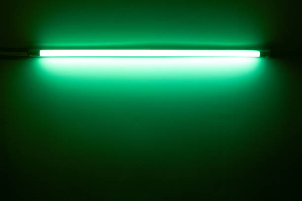 istock Green neon lamp on a white wall 1459290195
