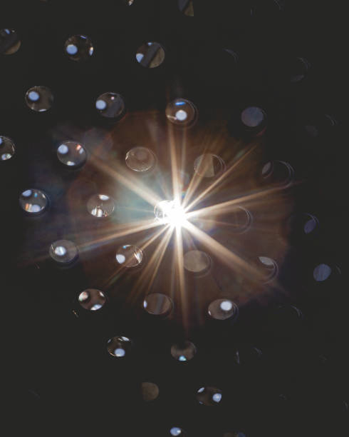 istock Vertical shot of the light falling through holes covered in spiderweb 1459290742