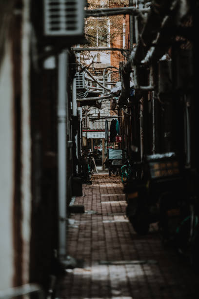 istock Selective focus shot of a thin road that goes through old buildings 1459292198