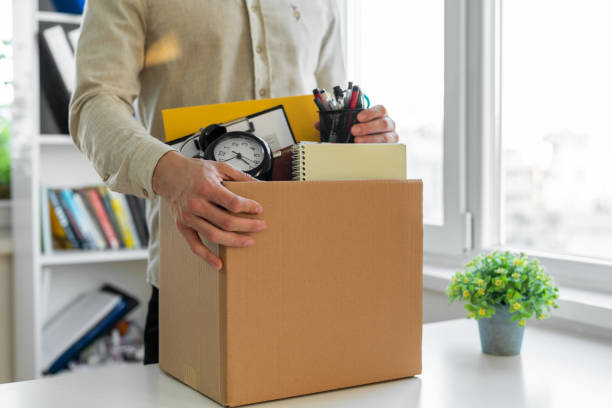 istock Sad dismissed worker taking his office supplies with him 1459292254