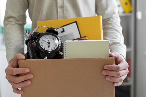 Man holding boxes for personal belongings