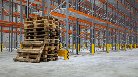 Empty stack pallets in logistics warehouse in Germany