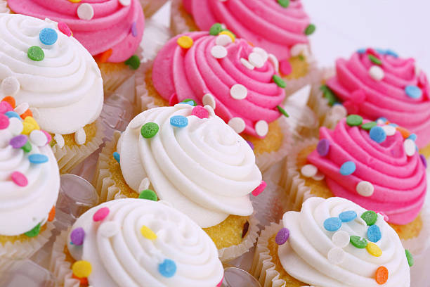 istock Pink and white cupcakes with iced sprinkles 145929278