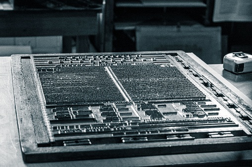 A closeup of a printing press machine