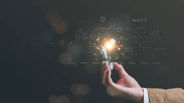 istock concept with innovation and inspiration, innovative technology in science concept and modern business development,creative idea,Businessman holding a light bulb showing getting new ideas 1459295911