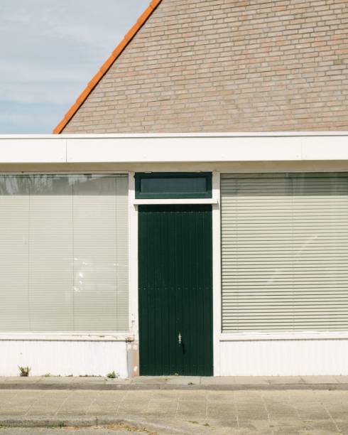 istock Minimalist dark green door in a modern building 1459296713