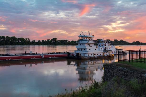 istock Large cruise ship moored on the Ohio River pier under a pink sunset sky 1459298358