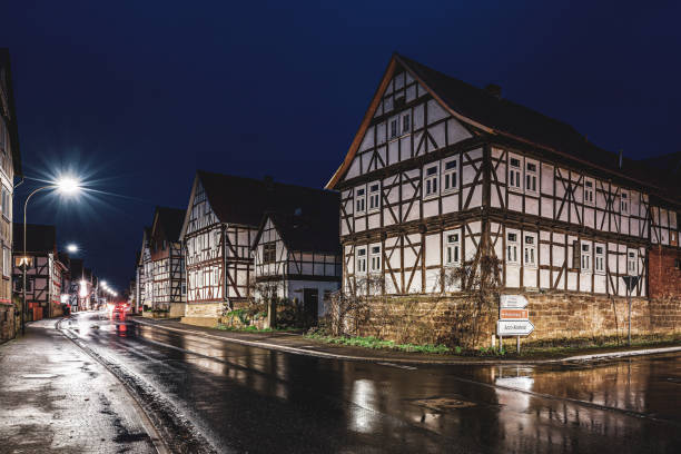 the historic village of herleshausen at night - house residential structure non urban scene tudor style imagens e fotografias de stock