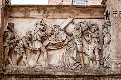 The medieval bas-relief with the biblical story of Carrying the Cross in Bamberg, Germany