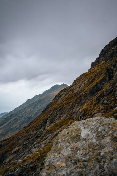 istock Vertical shot of the mountainous landscape under a cloudy sky 1459298631