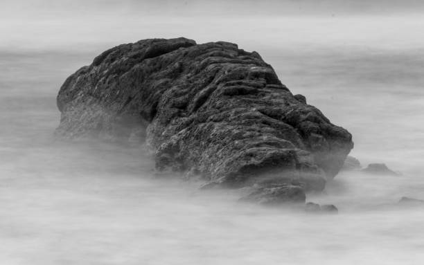istock Rocky cliff in the ocean 1459298859