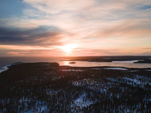 istock Beautiful sunset over the snow covered forest and lake 1459299349