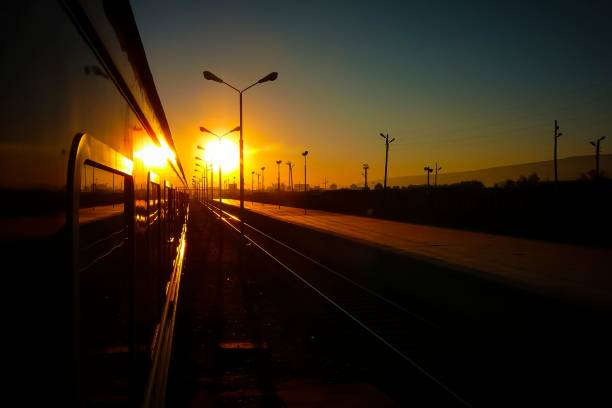 istock Passenger train waiting for departure in the station during sunset 1459299643