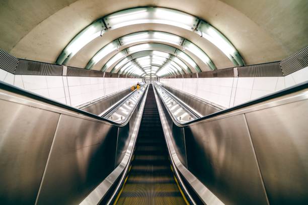 istock Beautiful low angle shot of an empty modern escalator with lights 1459301012