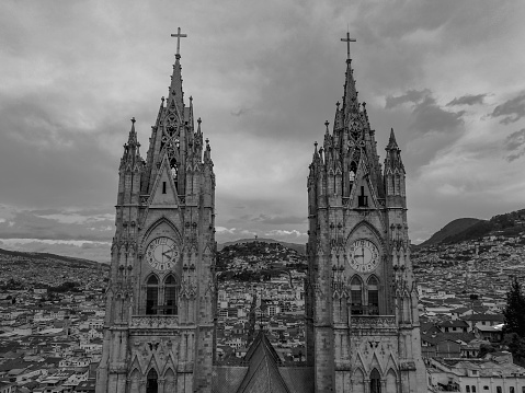 A grayscale shot of the Basilica of the National Vow's towers in the center of Quito, Ecuador.
