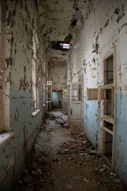 istock Empty corridor of an abandoned building with damaged walls, doors and windows 1459302404