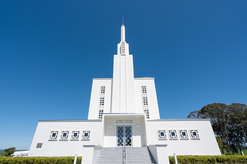 A low-angle of Hamilton New Zealand temple on a sunny day with clear sky background