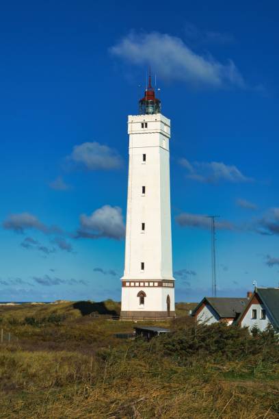 istock White Blavand Lighthouse against the blue sky in Denmark 1459307511