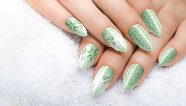 istock Beautiful woman's nails with beautiful green manicure 1459307656