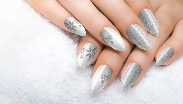Beautiful woman's nails with beautiful grey manicure