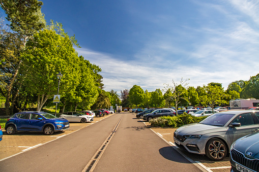 Parking Lot at Bute Park in Cardiff, Wales, with car number plates visible.