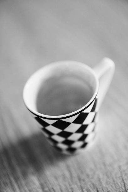 istock Grayscale high-angle shot of a ceramic tea cup with rhombus pattern 1459309352