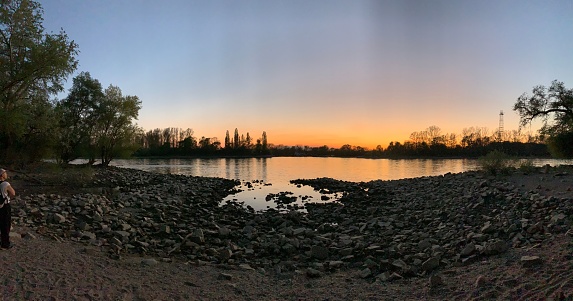 A beautiful sunset over the rocky lake shore